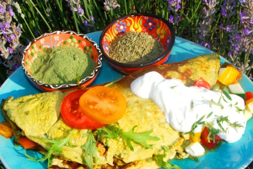 Green omelette stuffed with ratatouille