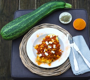 Zucchini boats with millet and soy mince