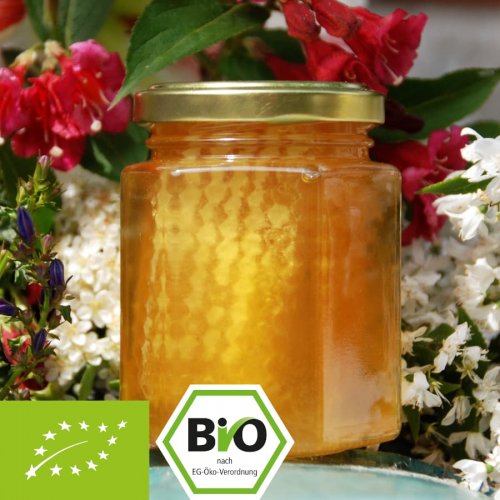 Biologische honing met hele honingraat 