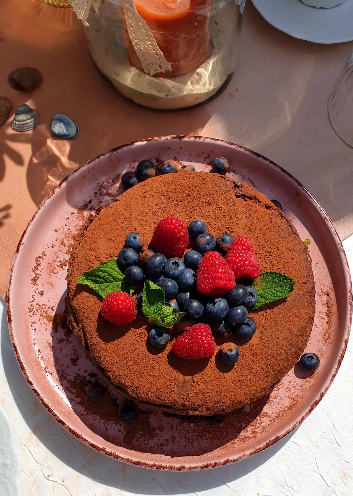 Chocolate cake with dates, raspberries & blueberries